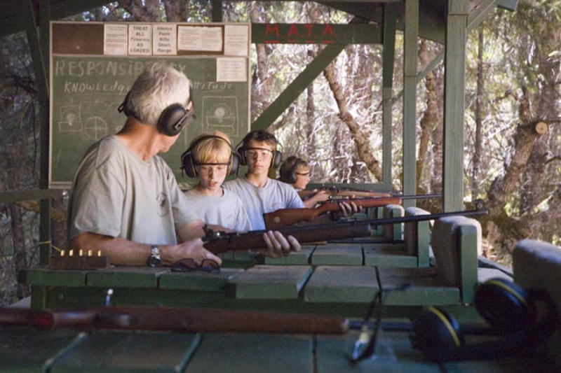 Adult and youth on the Rifle Range.