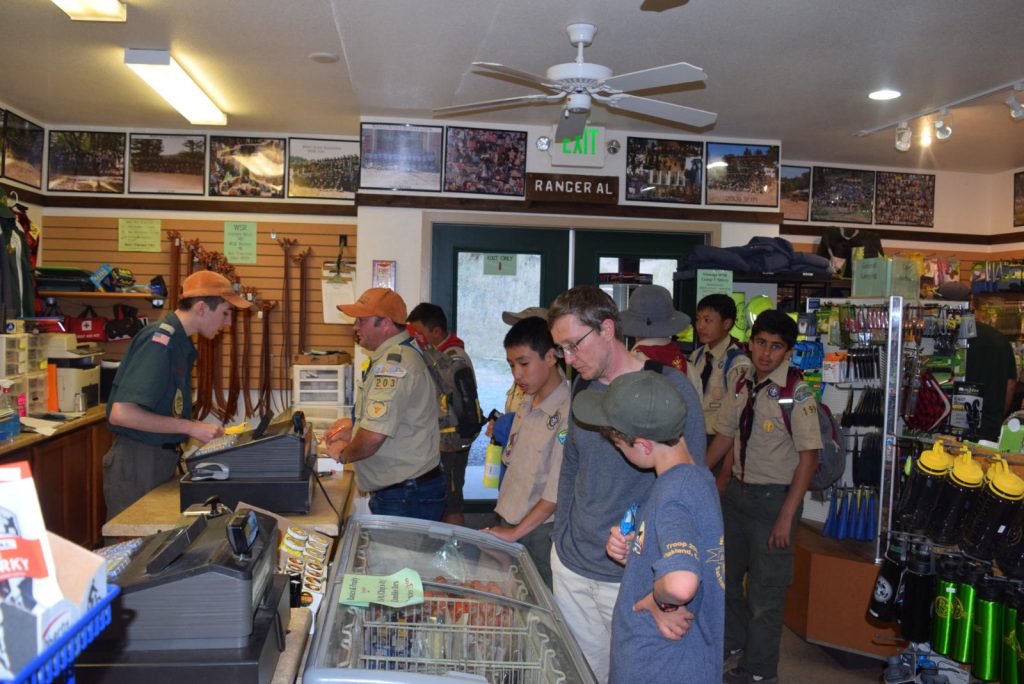 Scouts taking a look around and making purchases at the Trading Post.