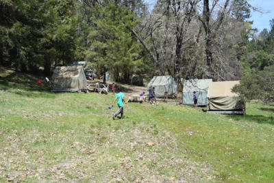 Scouts playing in the open space of Sailor's Rest campsite sign.