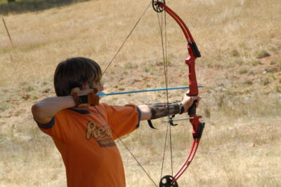 Scout shooting an arrow at the Dunnigan Archery Range.